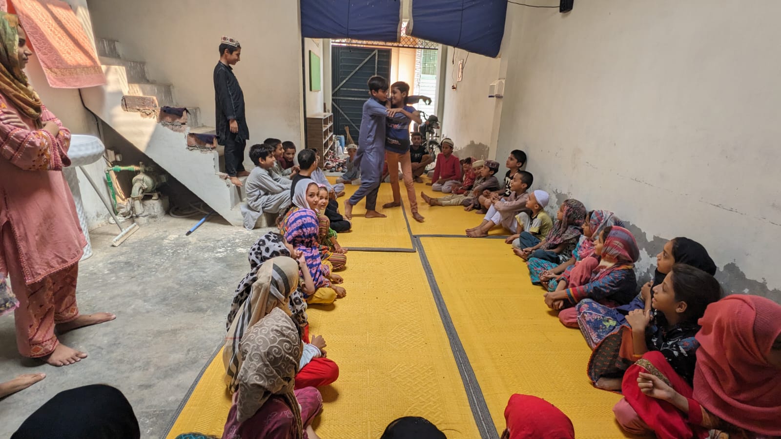 Children and youth participating in circle activity