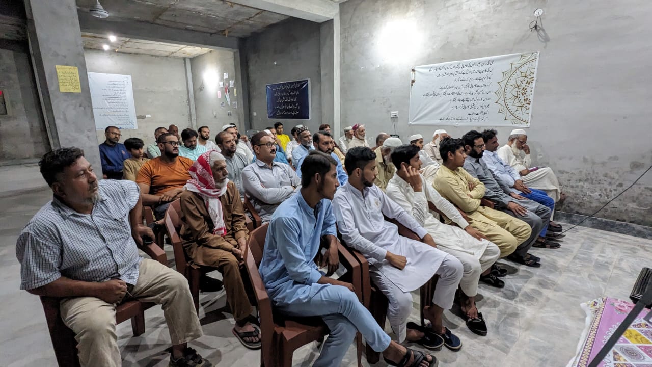 Men attending a public awareness lecture